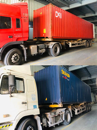 Two container trucks are loading baby diapers.